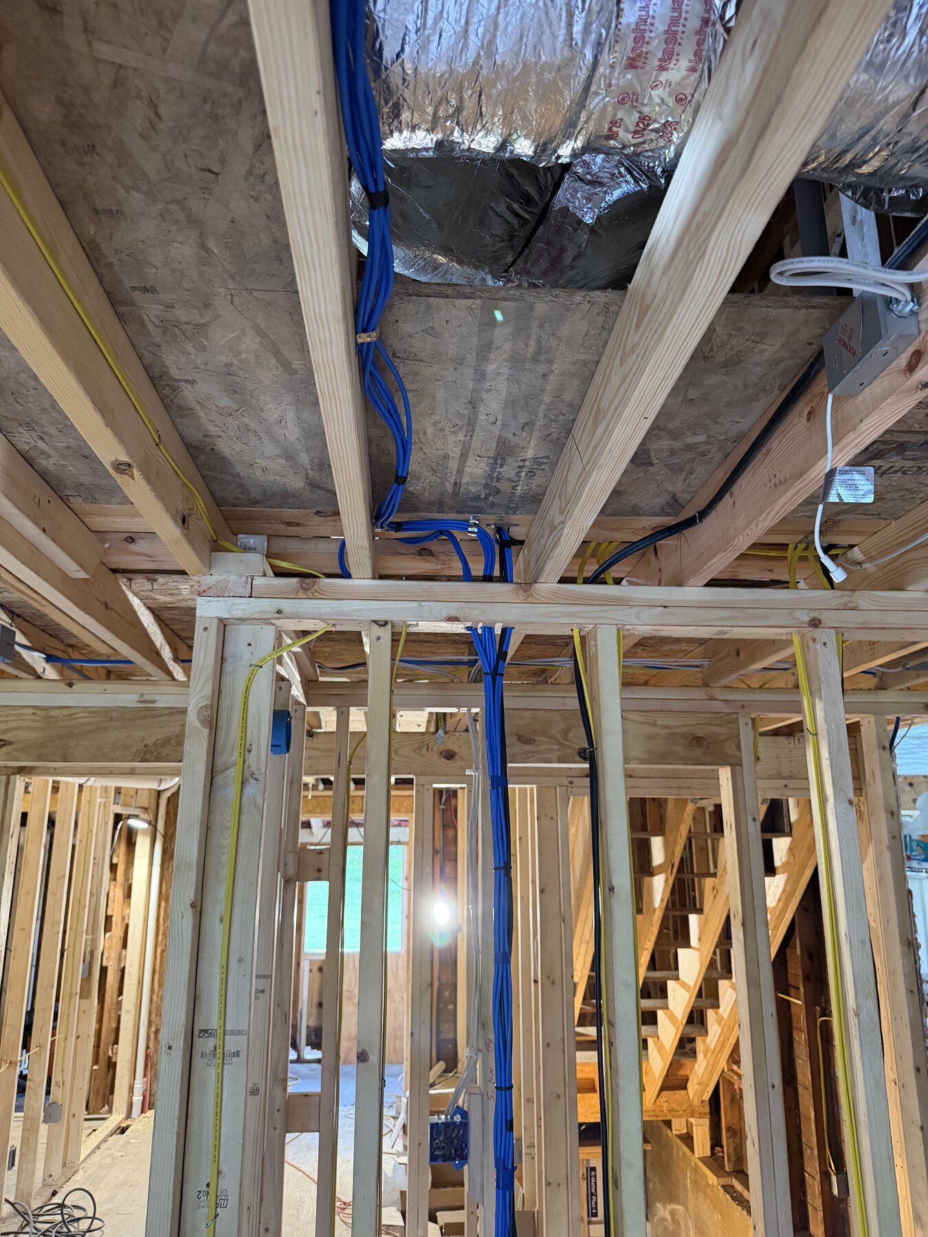 Low-voltage wiring routed cleanly through new-construction framing in Blacksburg Virginia