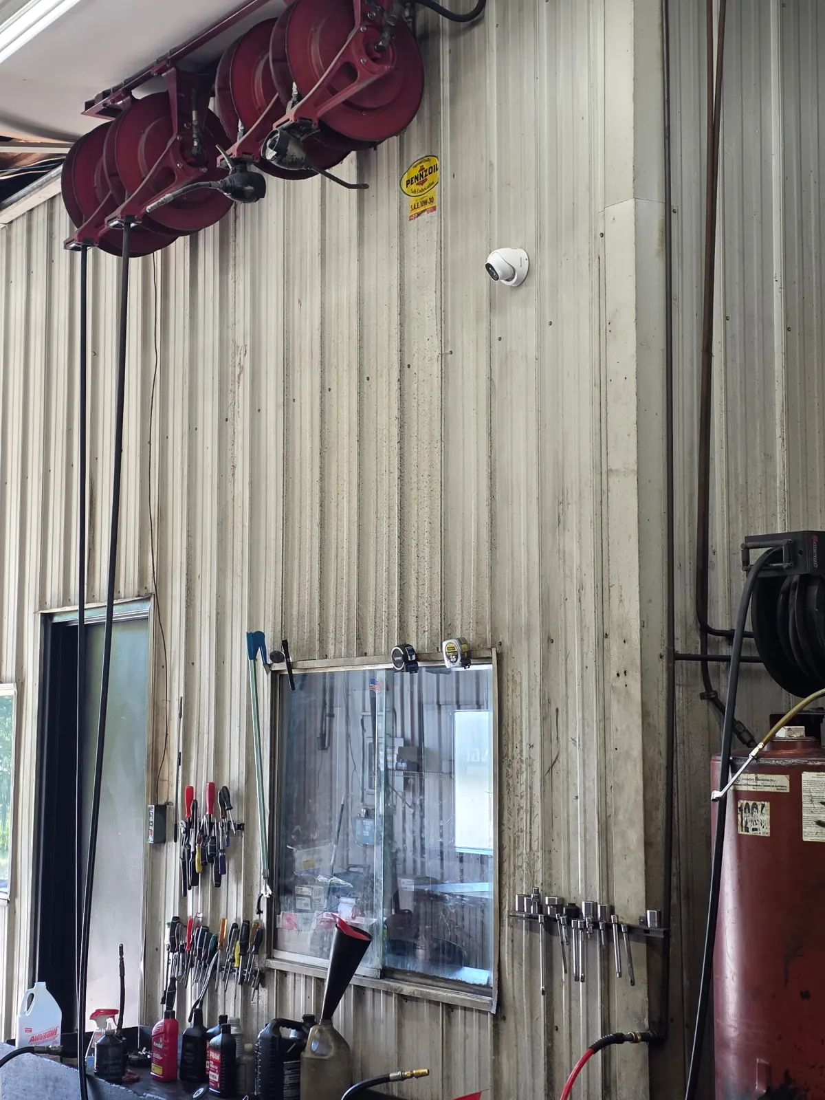 Dome camera installed above the workbench in the Redline Tire and Lube service bay