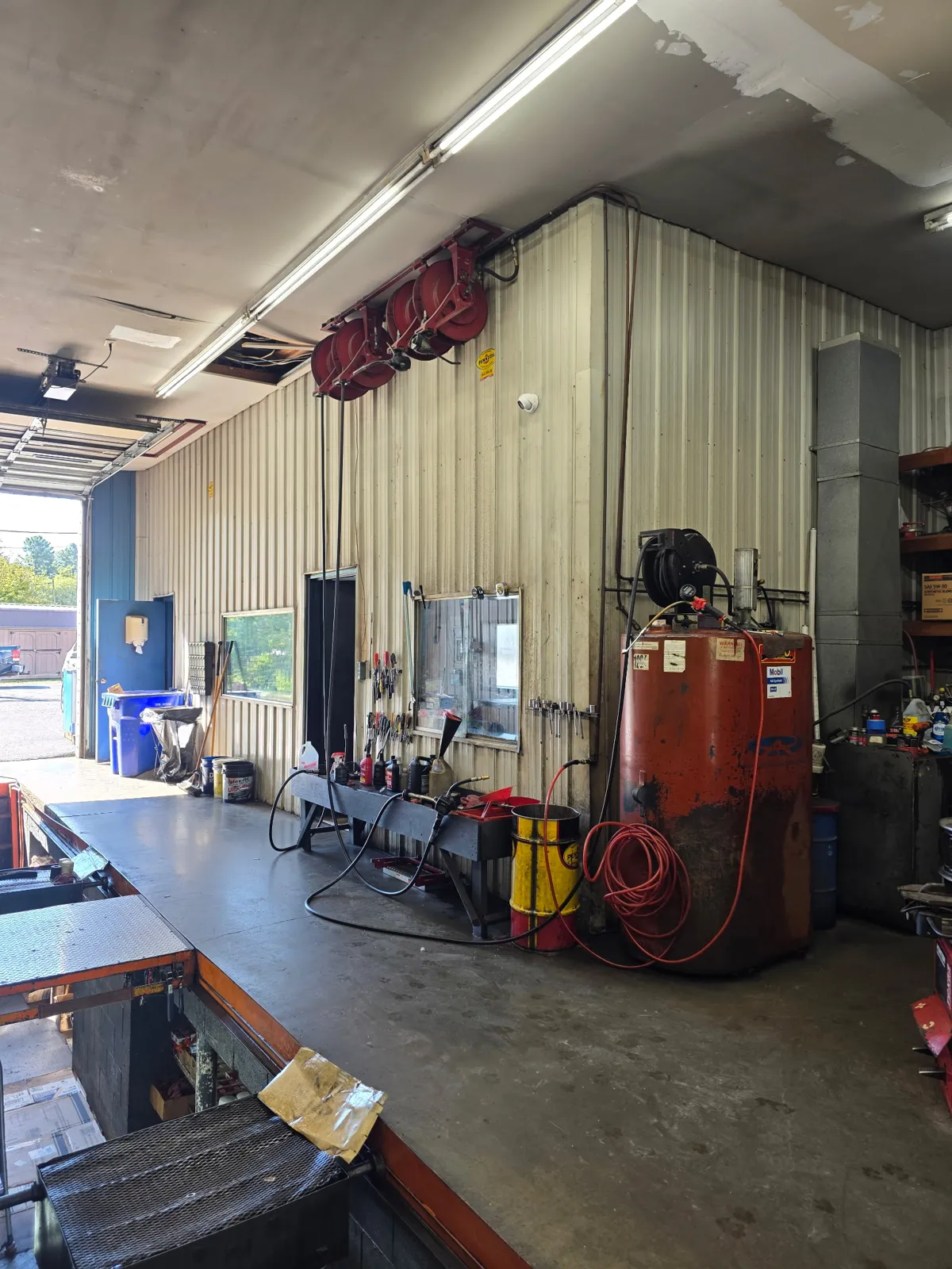 Wide view of a service bay showing security camera placement at a Christiansburg auto shop