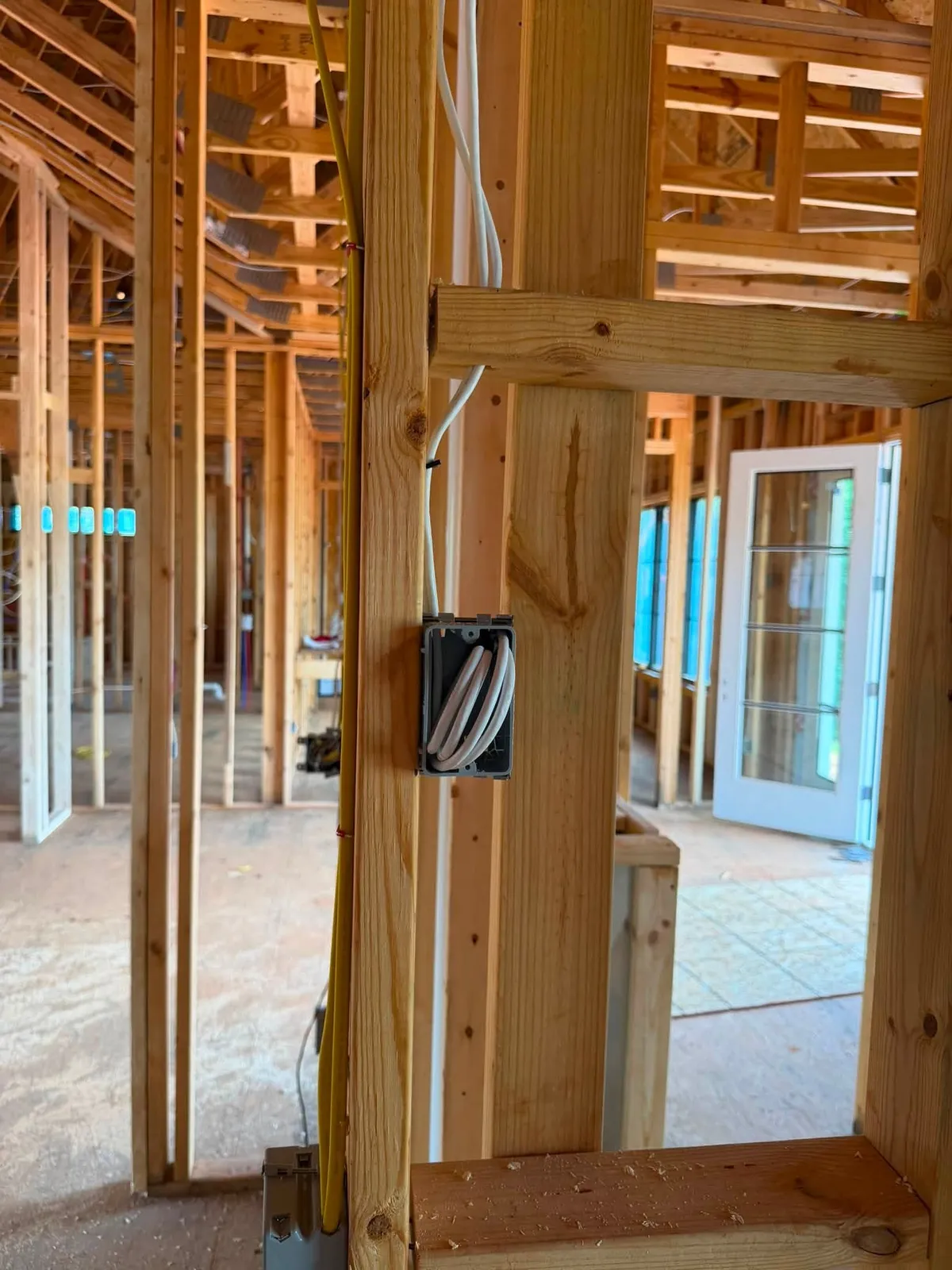 CAT6 network outlet with a coiled service loop left for termination in a Rocky Mount VA new build