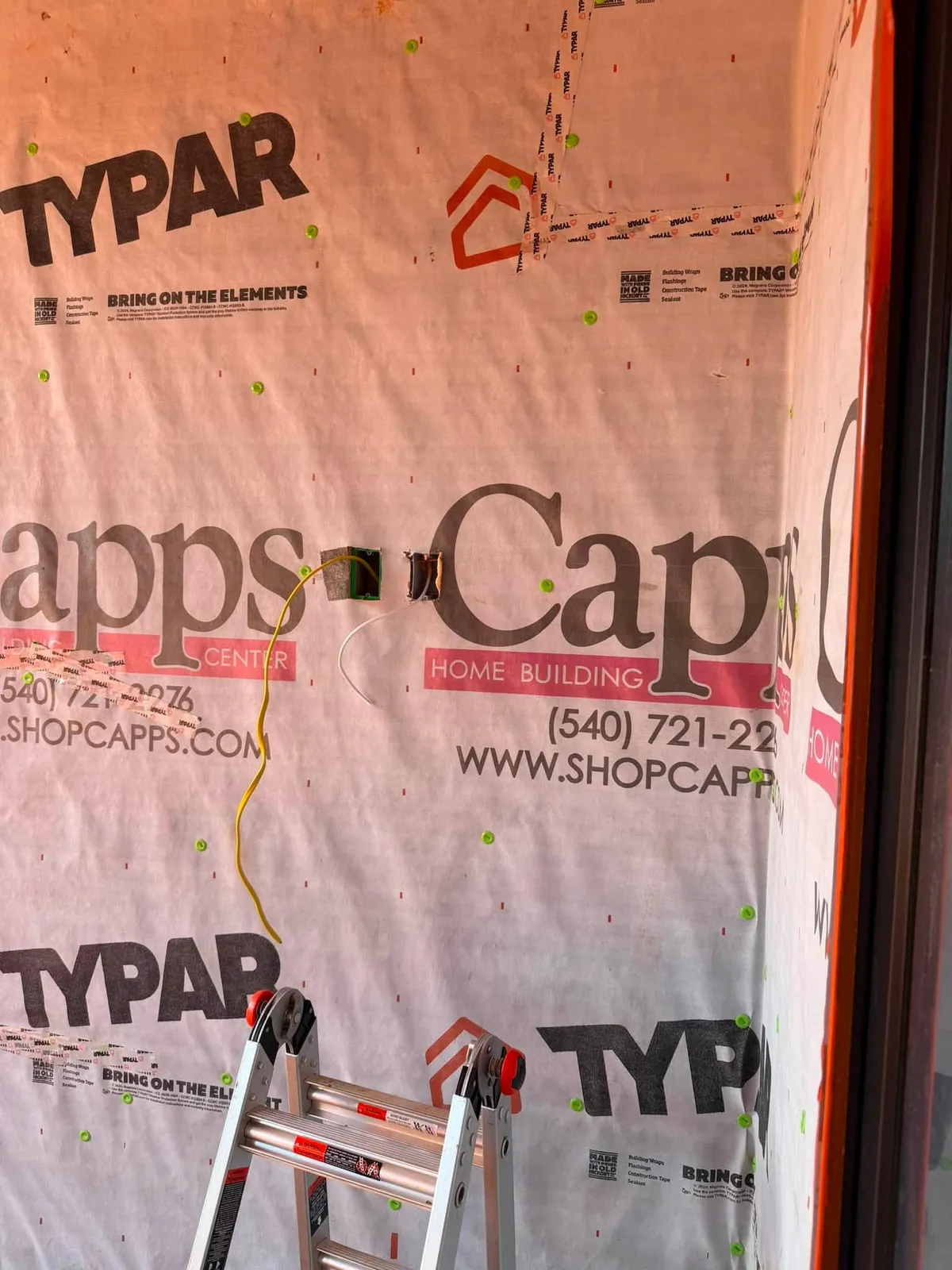 Exterior security camera network cable prewire on a housewrapped wall in Rocky Mount Virginia new construction