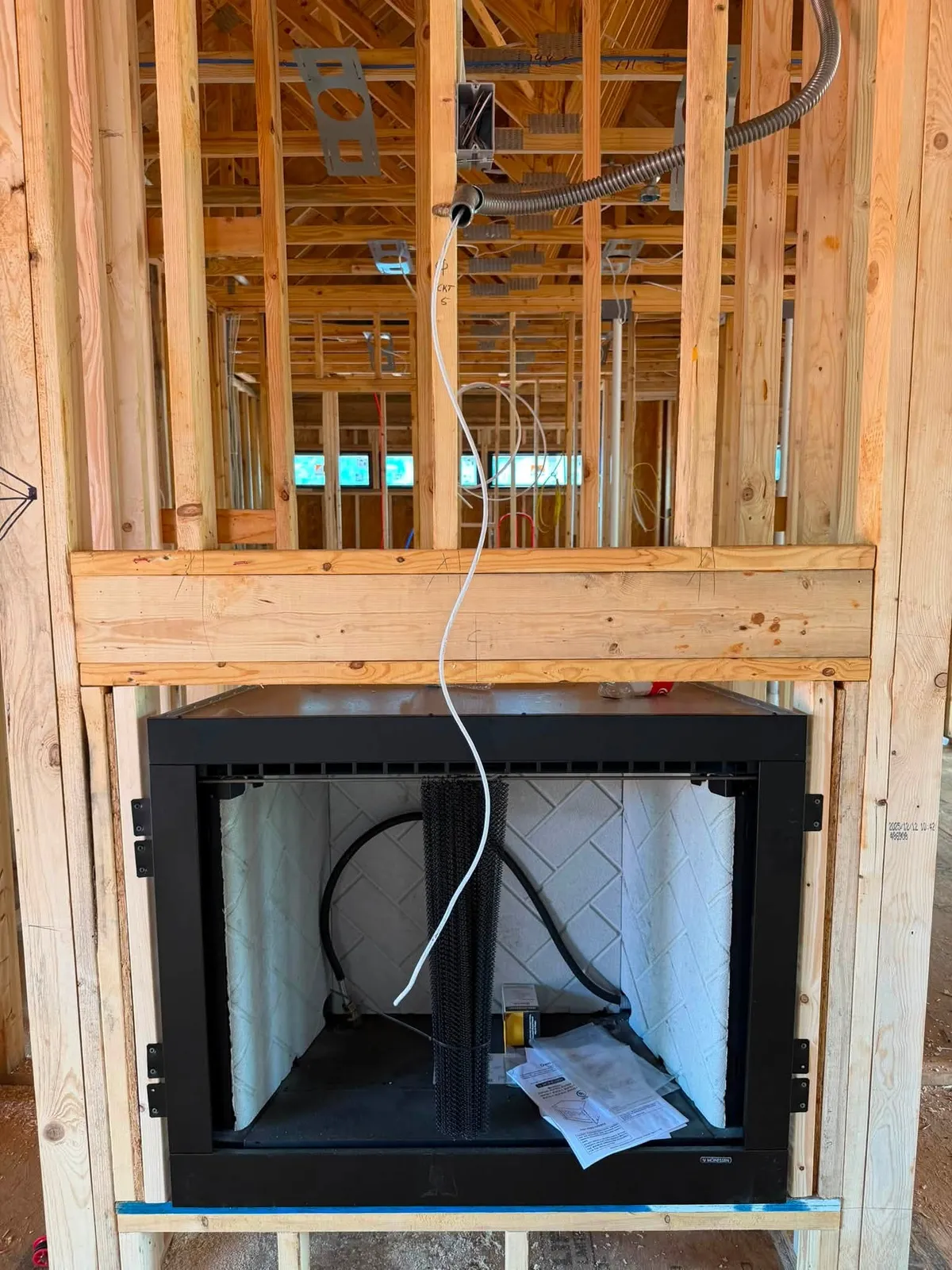Network cable dropped to a fireplace and television location in a new construction home in Rocky Mount Virginia