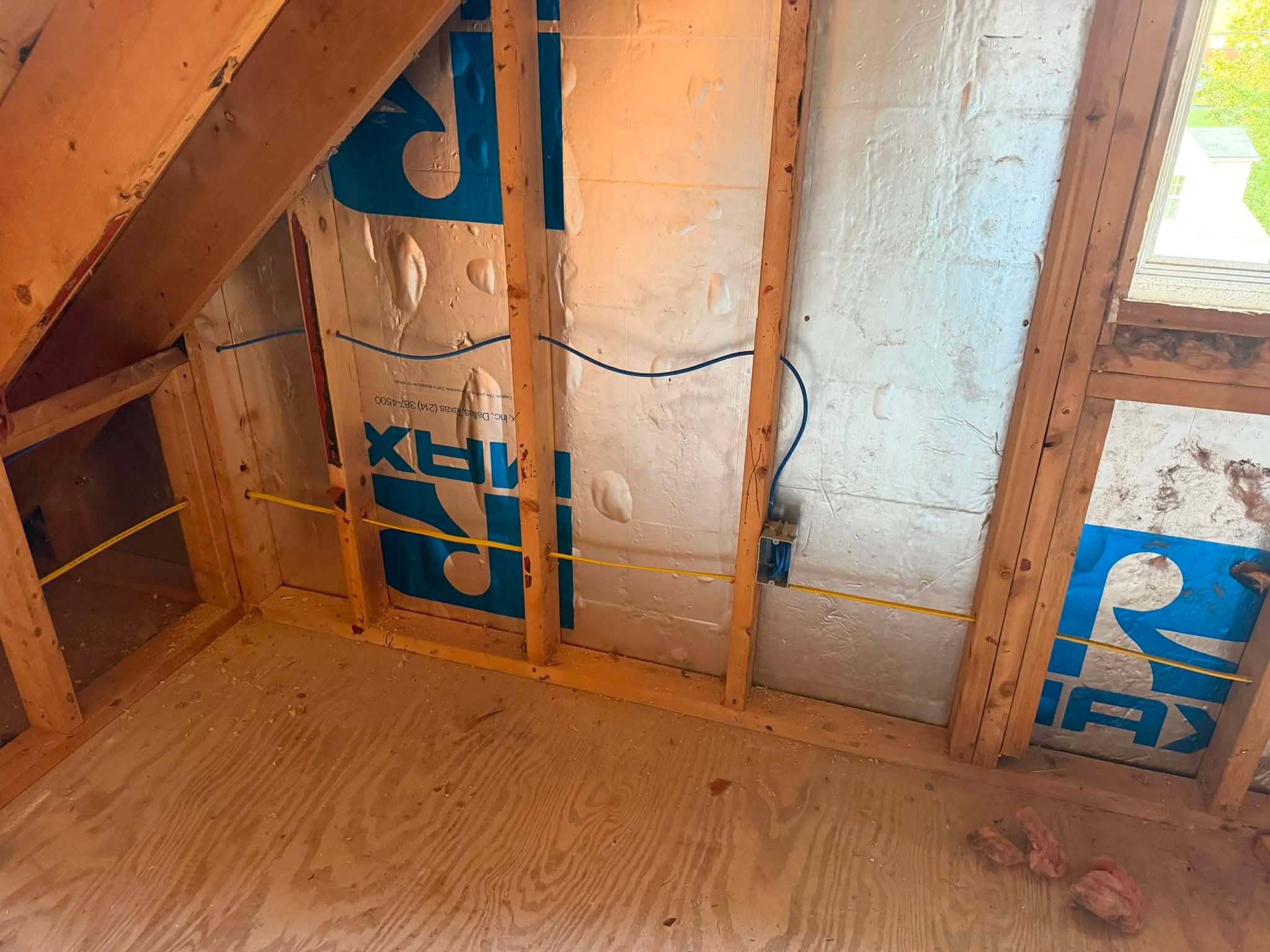Upstairs room with low-voltage and electrical cables pre-wired through insulated walls and vapor barrier