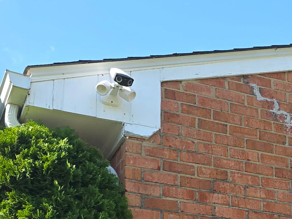 Reolink Duo 180-degree floodlight camera mounted on the gable trim of a Salem, VA home