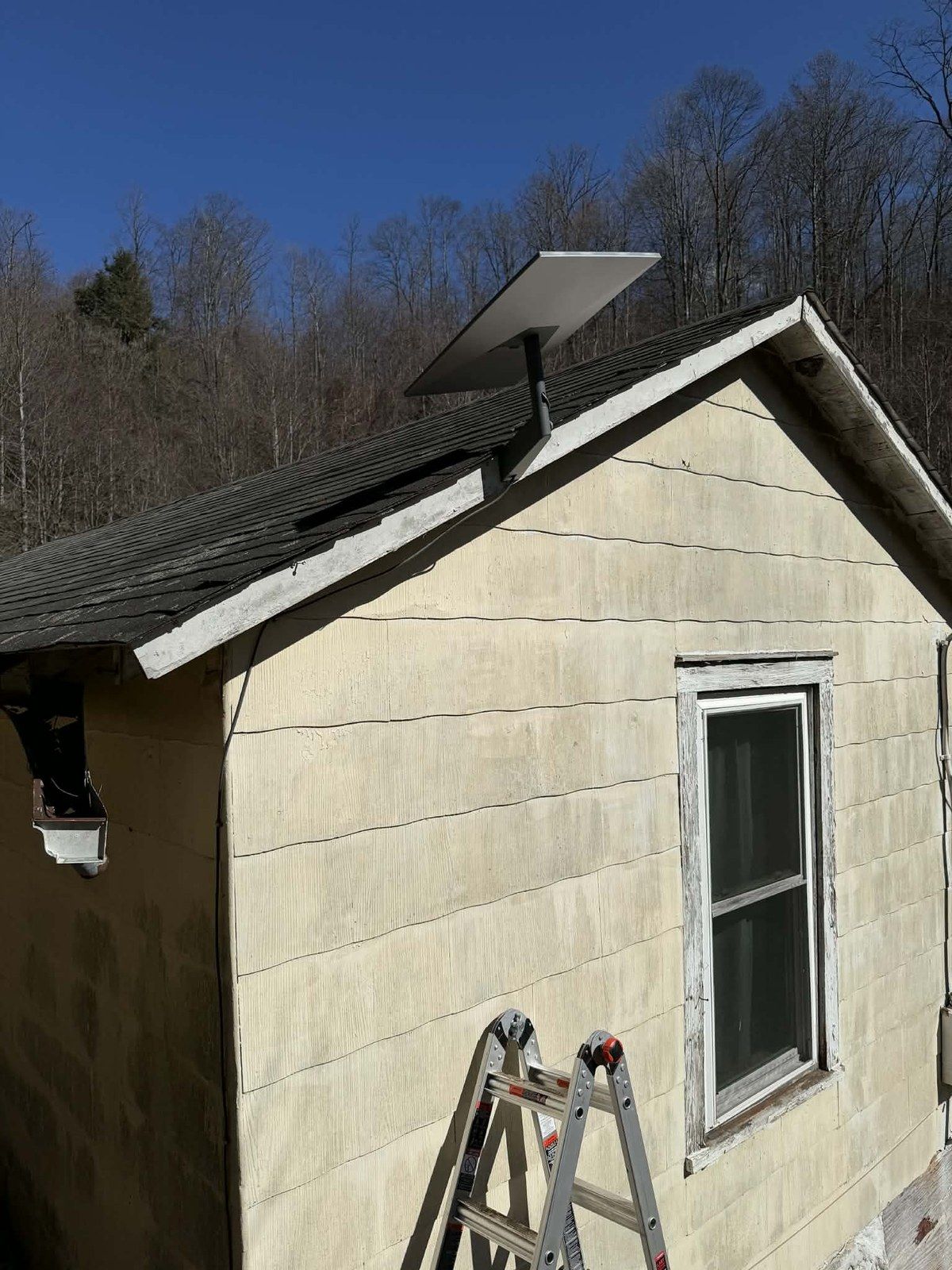 Starlink dish mounted on roof — original install