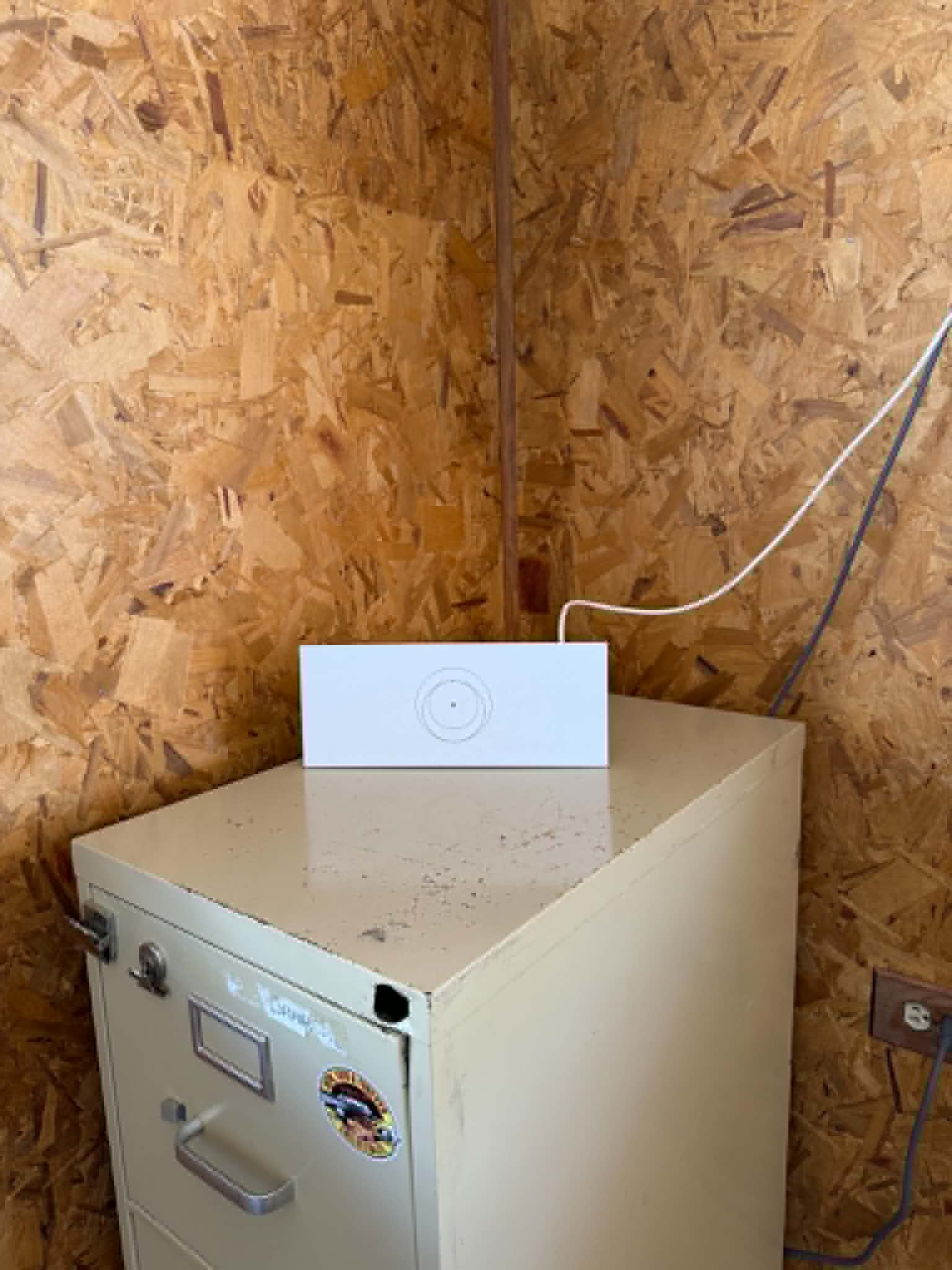 Starlink router on filing cabinet — indoor setup